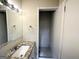 Simple bathroom with subway tile shower and granite vanity at 1271 Avonwood Sw Cir, Atlanta, GA 30311
