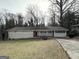 Charming ranch house with a spacious yard and driveway at 1271 Avonwood Sw Cir, Atlanta, GA 30311