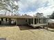 House with sunroom and covered patio at 1931 Sandringham Sw Dr, Atlanta, GA 30311