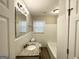 Clean bathroom with granite vanity and a bathtub at 1931 Sandringham Sw Dr, Atlanta, GA 30311