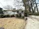 Ranch home with a driveway and mature trees at 1931 Sandringham Sw Dr, Atlanta, GA 30311