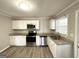 Modern kitchen with stainless steel appliances and granite countertops at 1931 Sandringham Sw Dr, Atlanta, GA 30311
