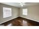 Spacious bedroom with hardwood floors and two windows at 2284 Headland Dr, East Point, GA 30344