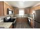 Modern kitchen featuring granite countertops and stainless steel appliances at 2284 Headland Dr, East Point, GA 30344