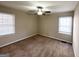 Bright bedroom featuring neutral walls and carpet, ceiling fan at 490 Woods Dr, Atlanta, GA 30318