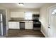 Updated kitchen featuring granite countertops and white cabinets at 490 Woods Dr, Atlanta, GA 30318