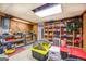 Finished basement with shelving, workbench, and storage at 260 Lawrenceville St, Mcdonough, GA 30253
