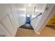 Basement stairs with wood railing and carpeted steps at 260 Lawrenceville St, Mcdonough, GA 30253