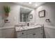 Elegant bathroom with granite countertop and frameless shower at 260 Lawrenceville St, Mcdonough, GA 30253