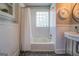 Clean bathroom featuring a shower/tub combo and mosaic tile floor at 260 Lawrenceville St, Mcdonough, GA 30253