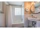 Clean bathroom featuring a shower/tub combo and mosaic tile floor at 260 Lawrenceville St, Mcdonough, GA 30253