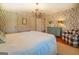 Main bedroom features hardwood floors and a leaf patterned wallpaper at 260 Lawrenceville St, Mcdonough, GA 30253