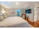 Spacious bedroom with large bed, sitting area, and ensuite bathroom at 260 Lawrenceville St, Mcdonough, GA 30253