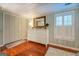 Well-lit bedroom featuring a dresser and ample closet space at 260 Lawrenceville St, Mcdonough, GA 30253