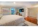 Comfortable bedroom with a large bed and access to a bathroom and closet at 260 Lawrenceville St, Mcdonough, GA 30253