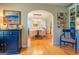Elegant dining room with arched entryway and round table at 260 Lawrenceville St, Mcdonough, GA 30253