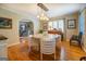 Bright dining room with hardwood floors and stylish light fixture at 260 Lawrenceville St, Mcdonough, GA 30253