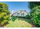 Side view of the house showcasing its classic design and landscaping at 260 Lawrenceville St, Mcdonough, GA 30253