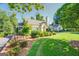 House exterior with driveway and landscaping at 260 Lawrenceville St, Mcdonough, GA 30253