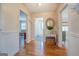Bright hallway with hardwood floors and access to other rooms at 260 Lawrenceville St, Mcdonough, GA 30253