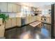 Updated kitchen featuring granite countertops and shaker cabinets at 260 Lawrenceville St, Mcdonough, GA 30253