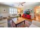 Living area with hardwood floors and a red media cabinet at 260 Lawrenceville St, Mcdonough, GA 30253