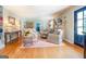 Hardwood floor living room features a fireplace and ample natural light at 260 Lawrenceville St, Mcdonough, GA 30253