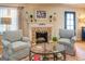Cozy living room with fireplace and two comfy armchairs at 260 Lawrenceville St, Mcdonough, GA 30253