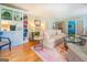 Bright living room with hardwood floors, comfy seating, and built-in shelving at 260 Lawrenceville St, Mcdonough, GA 30253