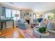 Spacious living room with hardwood floors and view into dining area at 260 Lawrenceville St, Mcdonough, GA 30253