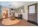 Sunroom with wicker furniture, gallery wall, and access to the backyard at 260 Lawrenceville St, Mcdonough, GA 30253