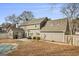 Gray house exterior with backyard access and patio at 123 Morallion Hills, Peachtree City, GA 30269