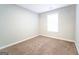 Simple bedroom with neutral walls and brown carpet at 6840 Silver Maple Dr, Rex, GA 30273