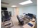 Basement office with desk, computer and exercise equipment at 1885 Jenny Ln, Lithia Springs, GA 30122