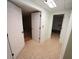 Basement hallway with access to multiple rooms and storage at 1885 Jenny Ln, Lithia Springs, GA 30122
