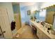 Large bathroom with double vanity, bathtub, and shower at 1885 Jenny Ln, Lithia Springs, GA 30122