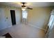 Well-lit bedroom with ceiling fan and window coverings at 1885 Jenny Ln, Lithia Springs, GA 30122