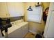 Laundry room with washer, dryer, and storage cabinets at 1885 Jenny Ln, Lithia Springs, GA 30122