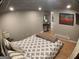 Finished basement bedroom with recessed lighting and small table at 3919 Evans Rd, Cumming, GA 30040