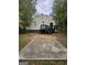 View of the back exterior, featuring a patio and access stairs at 2001 Merle Cir, Decatur, GA 30032