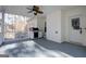 View of outdoor grilling station and patio area from covered back porch with ceiling fan at 90 Barrington Grange Dr, Sharpsburg, GA 30277