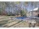 Large backyard featuring a swimming pool with cover, patio and porch at 90 Barrington Grange Dr, Sharpsburg, GA 30277