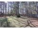 A spacious backyard featuring a well-kept lawn with a green storage shed at 90 Barrington Grange Dr, Sharpsburg, GA 30277