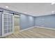 Finished basement featuring recessed lights, barn door and spacious layout at 90 Barrington Grange Dr, Sharpsburg, GA 30277