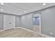 Finished basement with double door closet and doorway to another room at 90 Barrington Grange Dr, Sharpsburg, GA 30277