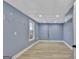 Finished basement space featuring wood look vinyl flooring and a window for natural light at 90 Barrington Grange Dr, Sharpsburg, GA 30277