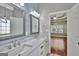 Elegant bathroom, featuring double vanity and marble countertops at 90 Barrington Grange Dr, Sharpsburg, GA 30277