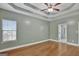 Bright bedroom featuring hardwood floors and access to bathroom at 90 Barrington Grange Dr, Sharpsburg, GA 30277