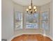 Charming dining area with large windows that offer picturesque views of the surrounding landscape and fill the space with light at 90 Barrington Grange Dr, Sharpsburg, GA 30277