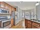 Well-appointed kitchen features stainless steel appliances, granite countertops, and ample cabinet space for storage at 90 Barrington Grange Dr, Sharpsburg, GA 30277